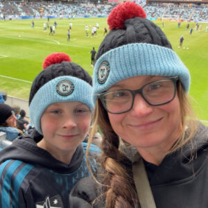 Photo of a woman and her son at a professional soccer game